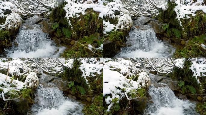 慢动作。在山河上下雪，流淌着石头巨石和石头急流。小溪里快速泼水。冬天的山溪。