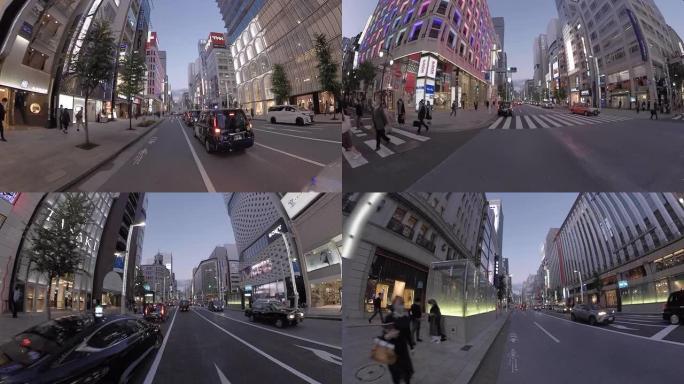 POV在城市里骑自行车。黄昏时骑自行车穿过银座。日本东京。交付服务的概念。时间流逝。动作相机拍摄。