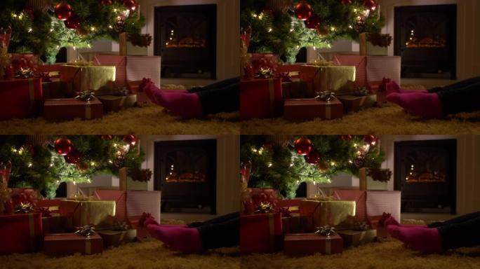 在圣诞节前夕，女人的脚在家里发冷