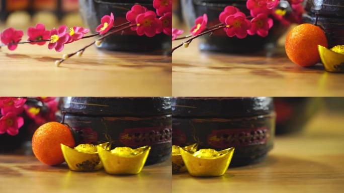 带有人造花和农历新年装饰金锭的中国古代篮子