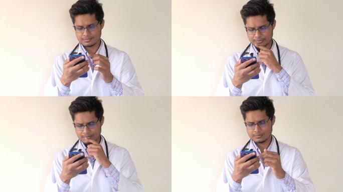 穿着白大褂的年轻亚洲医生使用智能手机。