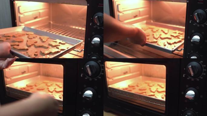电烤箱的前视图，观点: 以下: 亚洲中层妇女的手准备，烘焙自制圣诞饼干，树星，姜饼，金属板上的袜子，