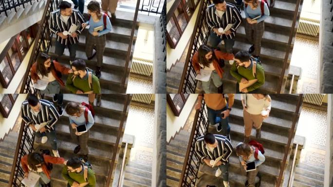 学生走下大学大楼的楼梯