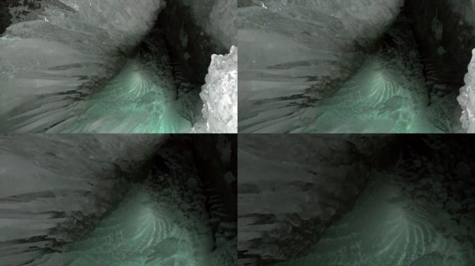 贝加尔湖天然冰川冰洞中的特写巨大冰柱霜冻。