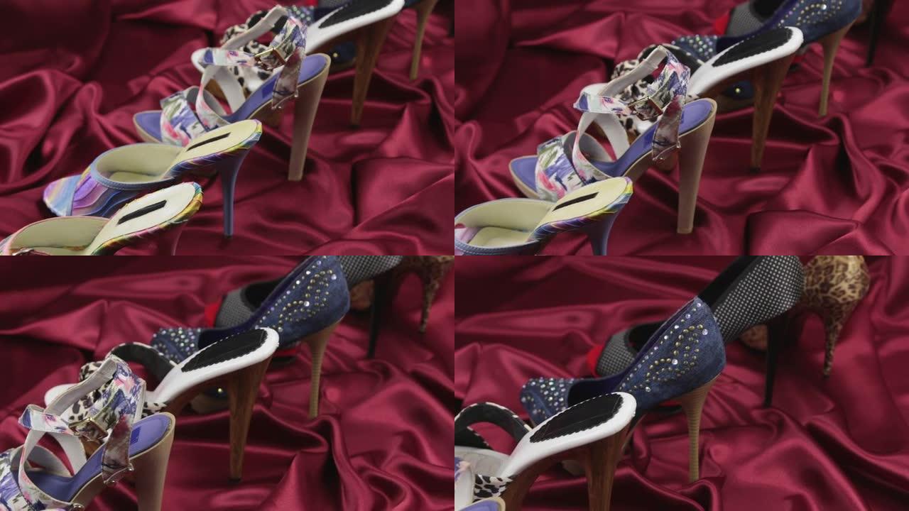 高跟鞋女鞋系列站在红色缎子上。滑块镜头。