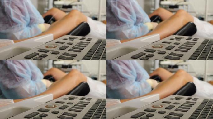 妇科手术，特写。模糊视图妇科医生使用监测超声机进行手术IVF卵泡穿刺以取回卵母细胞。通过超声波键盘拍
