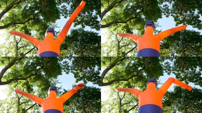 橙色古怪的挥舞充气管。挥舞着手臂的Tube Man邀请到城市公园度过万圣节。广告吹管人。冒险公园。户