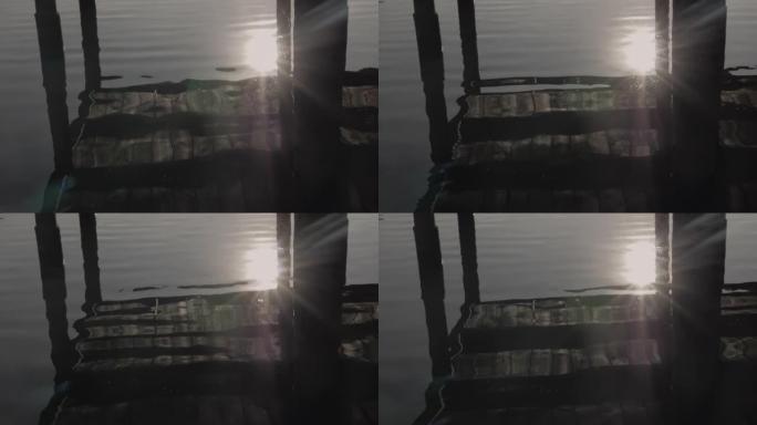 湖边河边日落，夕阳西下，河上的一座木桥