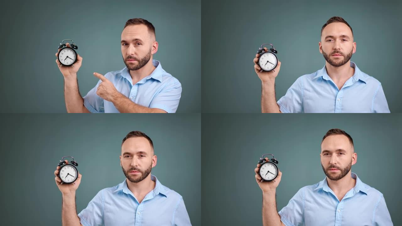 专注的大胡子男人拿着闹钟显示时间截止日期。4k红色相机上的中特写镜头