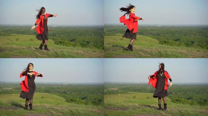 格鲁吉亚妇女在佐治亚州的绿色山丘上穿着红色民族服装跳舞。格鲁吉亚文化生活方式。