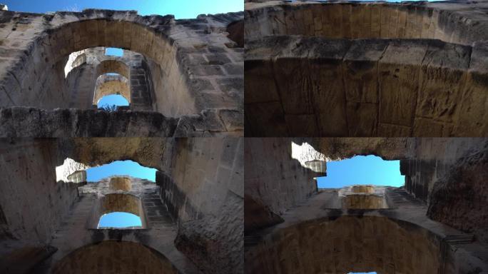 古罗马遗址。位于突尼斯El Jem的古代圆形剧场。柱子之间的通道。历史地标。