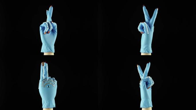女人手腕手和胜利象征。交出蓝色医疗装饰手套PPE。一次性手术防护手套中的女性手掌。概念战与COVID