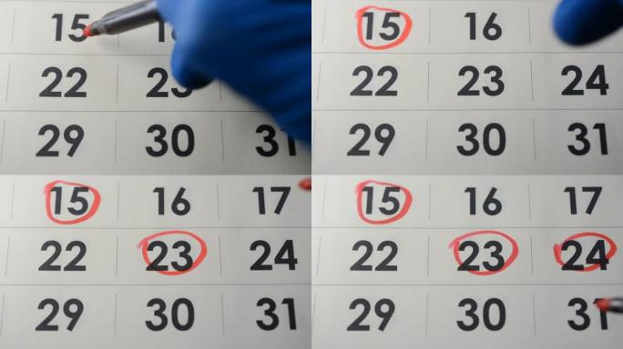 戴蓝色手套的医生手在日历上突出显示手术日期