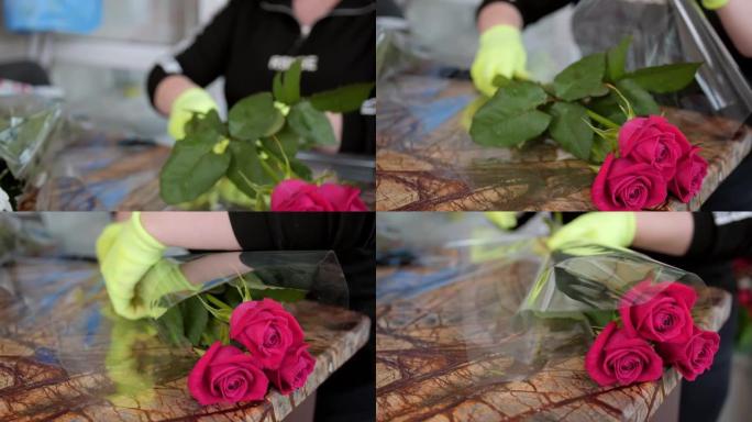 女花店用透明箔包裹柔和的玫瑰