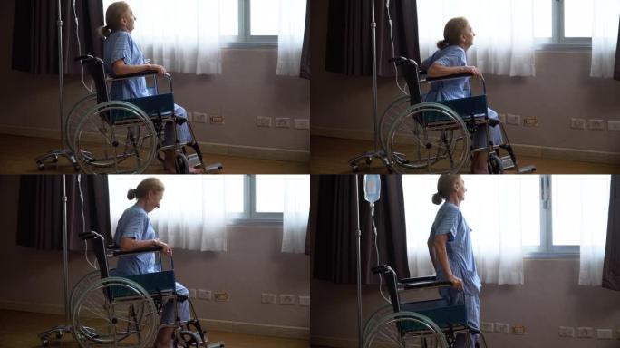 资深女性患者独自坐在轮椅上，望着窗外，试图站起来，直到在医院病房取得成功。孤独的老年女性在康复疗养院