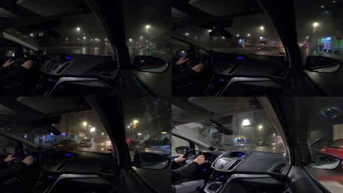 雨雾中夜间驾车穿越城市-视频4k镜头汽车驶过城市，从乘客的角度看gopro摄像机