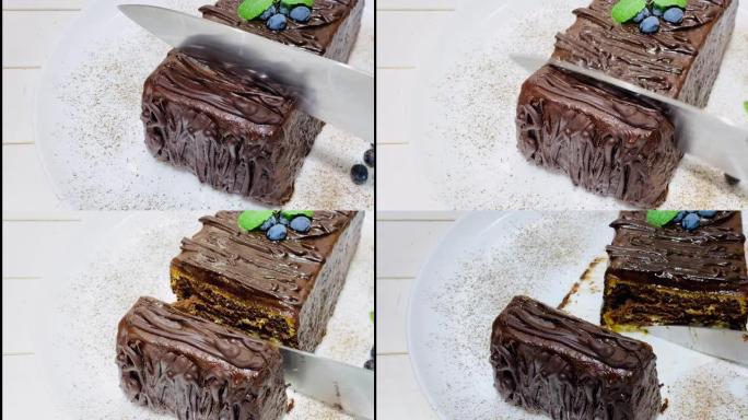 用刀切开巧克力蛋糕。