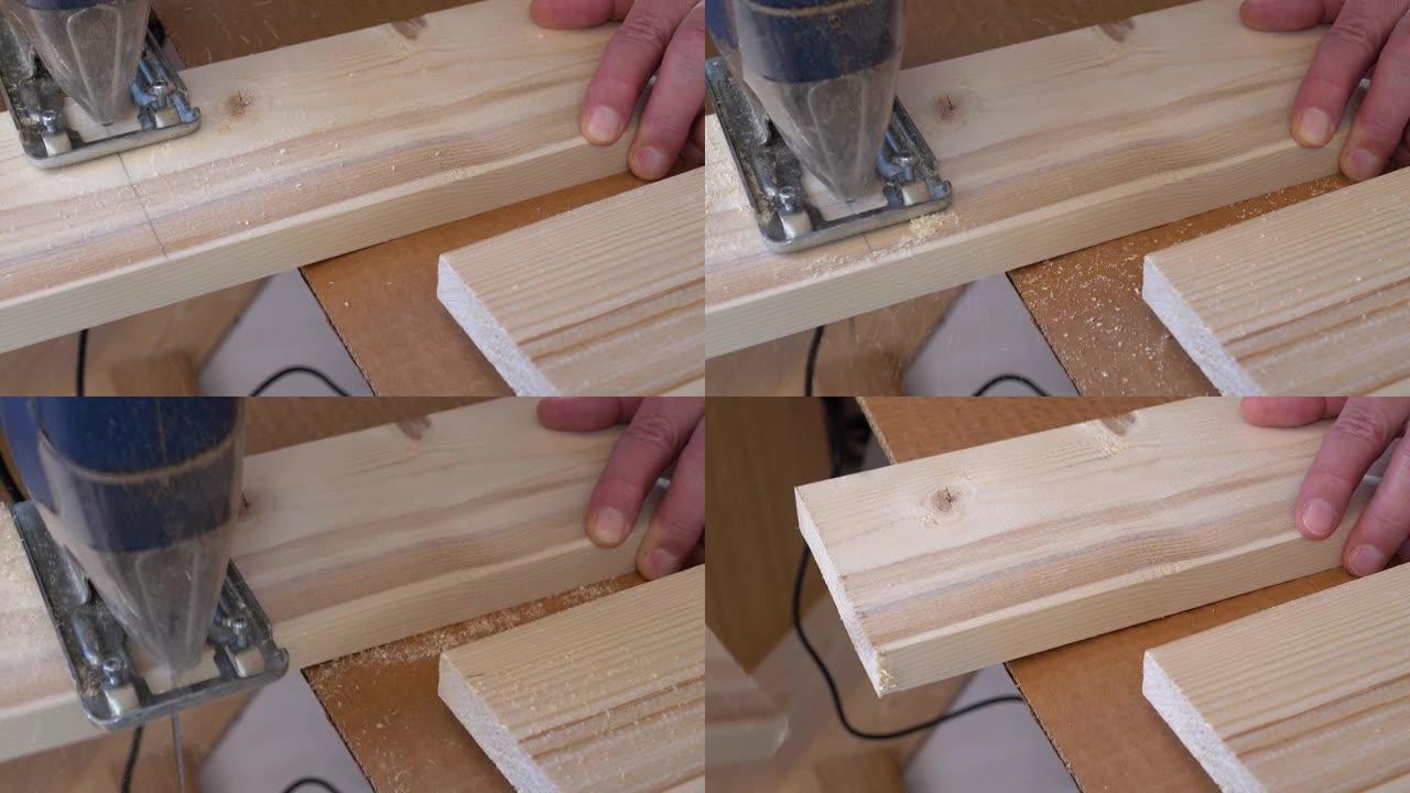 木匠用电动拼图切断了木板的一部分