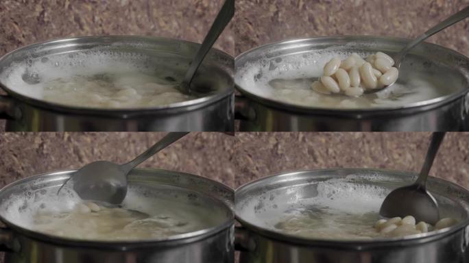 豆类烹饪在平底锅中的沸水中处理白豆种子。