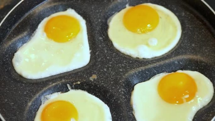 烹饪煎鸡蛋在平底锅上阳光朝上，鸡蛋仅在一侧油炸。蛋黄仍然是完全液态的，表面的白色几乎没有固定。