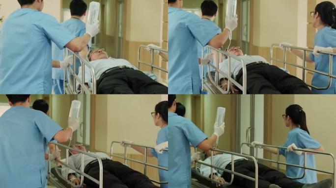 一组医生、护士和外科医生在医院走廊抬着躺在担架上的重伤病人。医护人员急忙将急诊老病人转移到手术室。