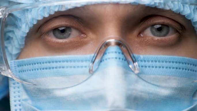 女医生脸，眼睛戴着安全眼镜。肖像医学女性佩戴保护和眼镜在医院或诊所关闭。健康员工看着相机。新型冠状病