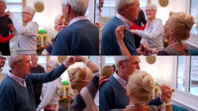 可爱的老年夫妇在养老院派对上跳舞