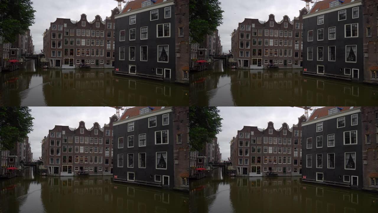 多云的一天阿姆斯特丹市中心著名的运河湾慢动作全景4k荷兰