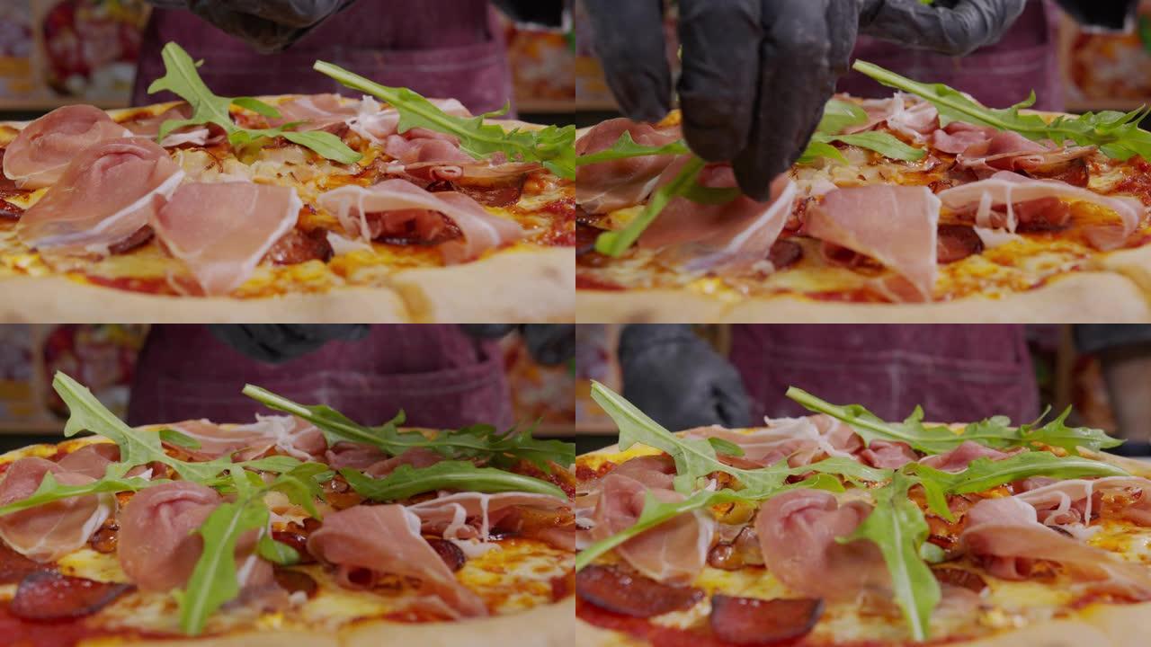 厨师在煮熟的比萨饼上撒上新鲜的香菜的特写镜头。在新鲜出炉的披萨上撒上装饰。隔离期期间在家做饭，大流行
