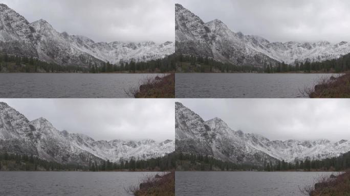 地平线上有白雪皑皑的山湖