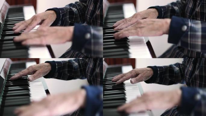 有着深深的皱纹的老女性手的特写弹钢琴。