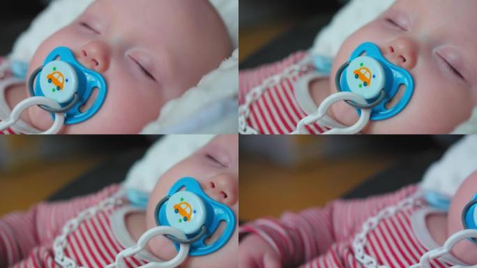 在家用安抚奶嘴睡觉的婴儿肖像。特写镜头。