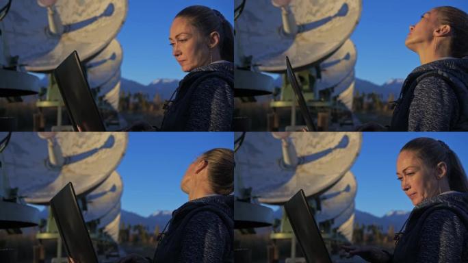 太阳地面物理研究所的女学生操作员监视笔记本中的通信设备。独特的阵列太阳射电望远镜。太阳射电望远镜。山