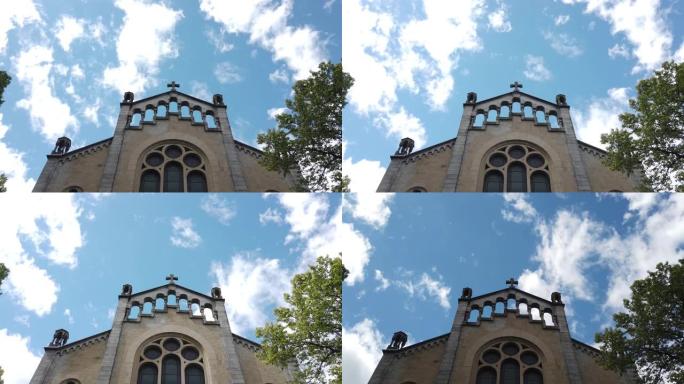 乌云在瑞士苏黎世市圣公会教堂的背景下快速移动