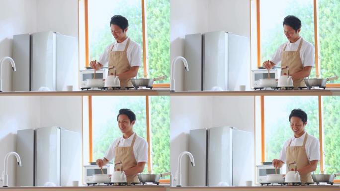 亚洲男子在家做饭做菜居家人物