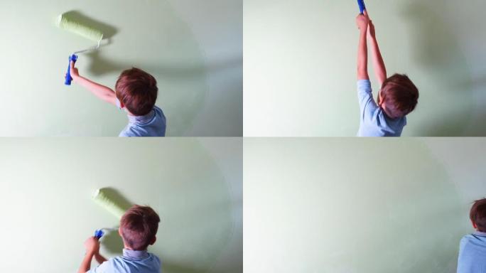 男孩在室内用手粉刷墙壁。用滚筒涂液体涂料表面