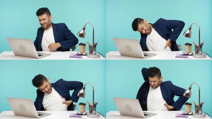 男性上班族在办公室的笔记本电脑上工作时感到背部疼痛，脊柱或肾脏问题，久坐的生活方式