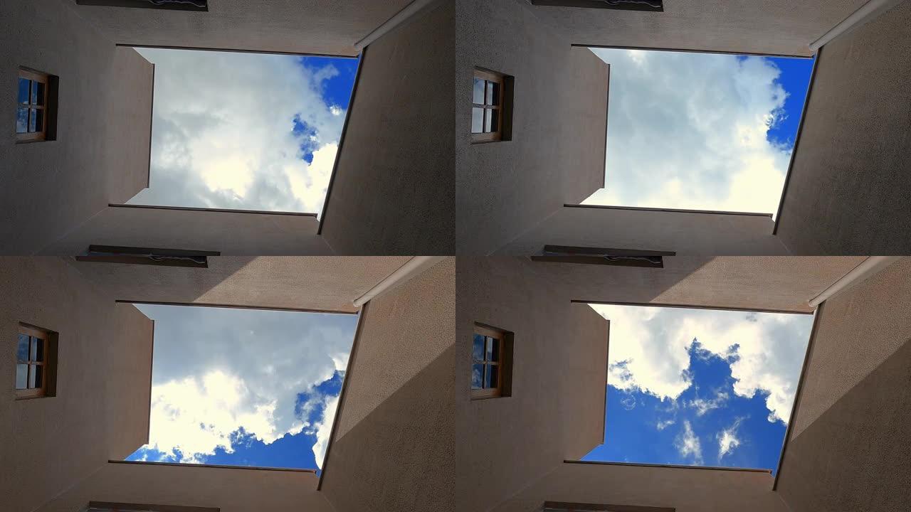 从房屋的低角度看，天空的时间流逝与云彩。