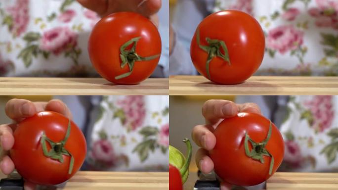 人从一只手到另一只手在切菜板上滚动成熟的番茄，收起，慢动作。为新鲜食品或烹饪节目拍摄自命不凡的广告