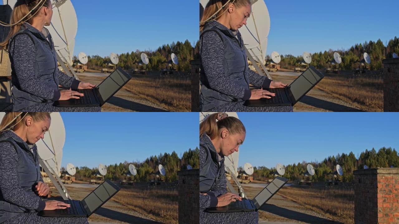 太阳地面物理研究所的女学生操作员监视笔记本中的通信设备。独特的阵列太阳射电望远镜。太阳射电望远镜。山