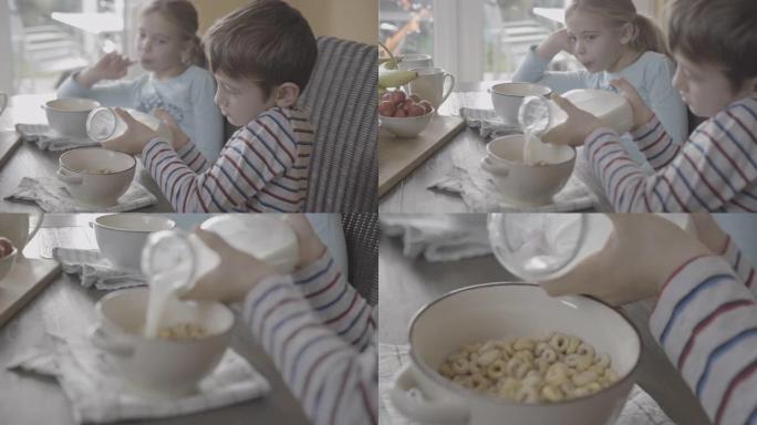 男孩在装满麦片的碗上倒牛奶