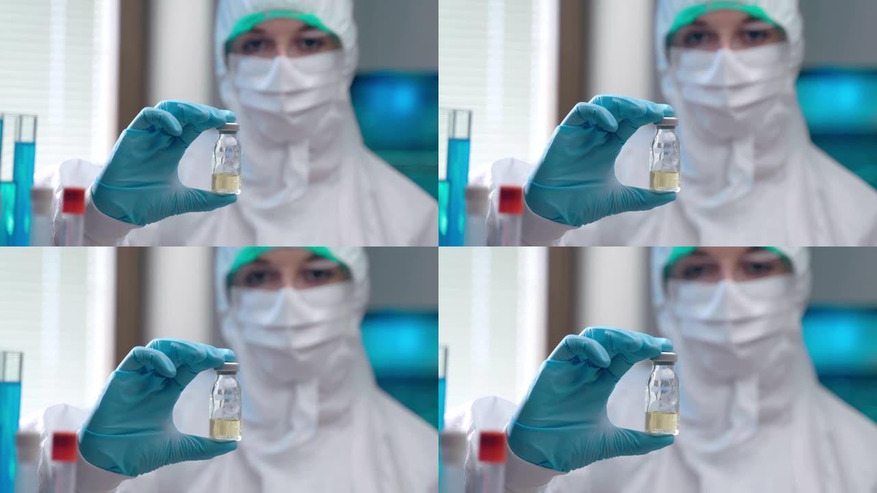 穿着防护服的专业女性病毒学家手中的潜在冠状病毒疫苗小瓶的特写镜头，自信的实验室工作人员在成功的化学实
