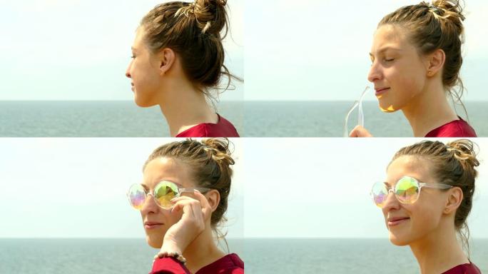 海滩上戴着墨镜的美丽年轻女子的肖像