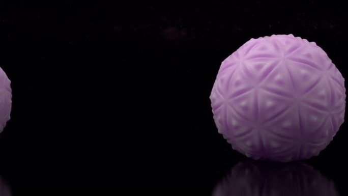 宇宙背景上未来派几何弹性球的环形3d设计。滚动橡胶球体的全景。