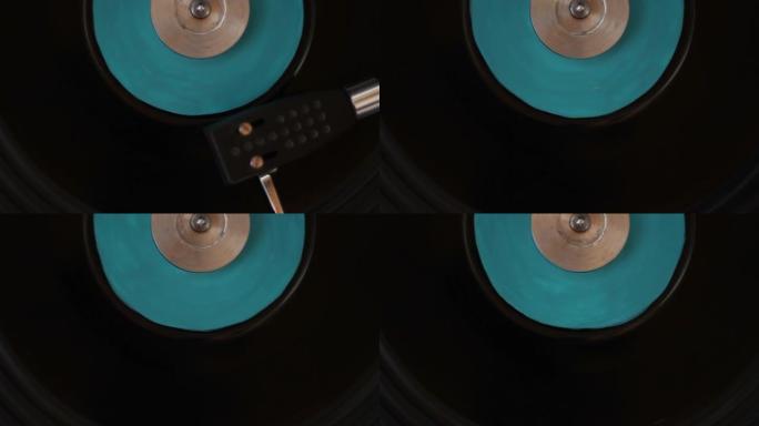 黑胶唱片上转盘针的特写。播放乙烯基的转盘。