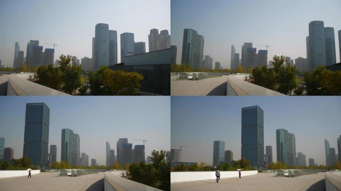 阳光灿烂的杭州城市现代河边城镇公园慢动作全景4k中国