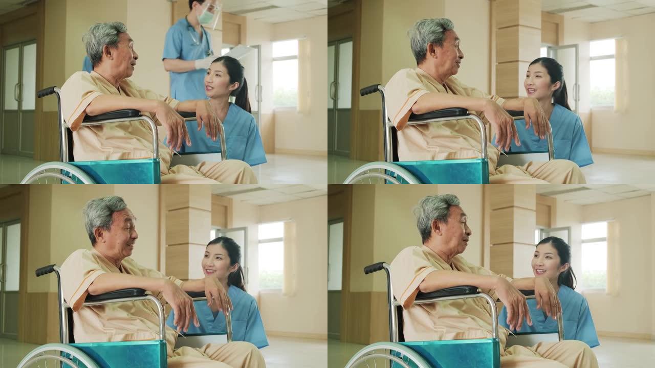 亚洲护士在医院照顾坐在轮椅上的成熟男性患者。年轻女子与老人交谈，照顾从手术中恢复的老病人。女孩对老人