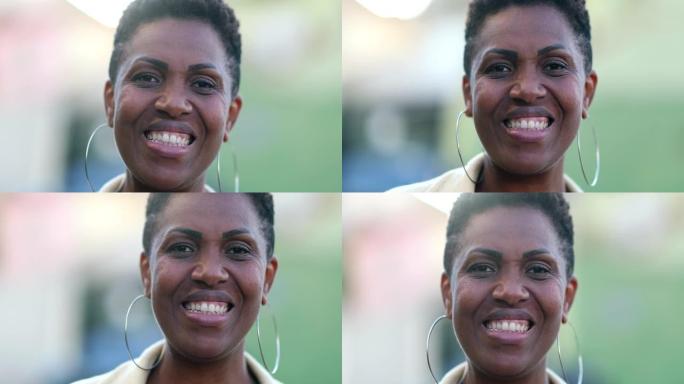非洲女人对着镜头微笑。混血人肖像脸特写，随性与真人