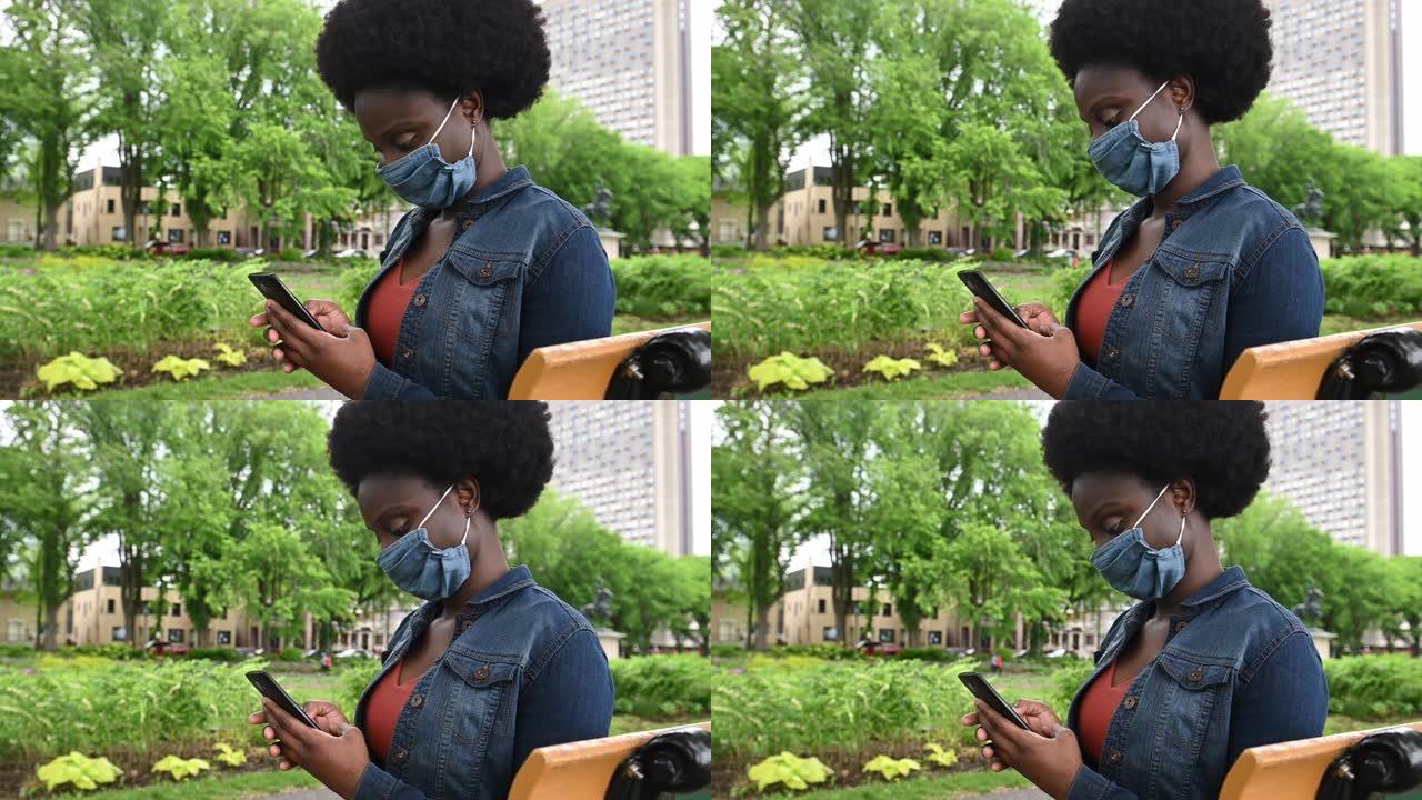 非裔美国妇女在公共公园戴自制面具