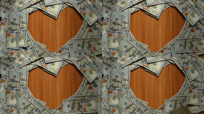 用美国100美元纸币创建一个心形边框，中间有一个复制空间